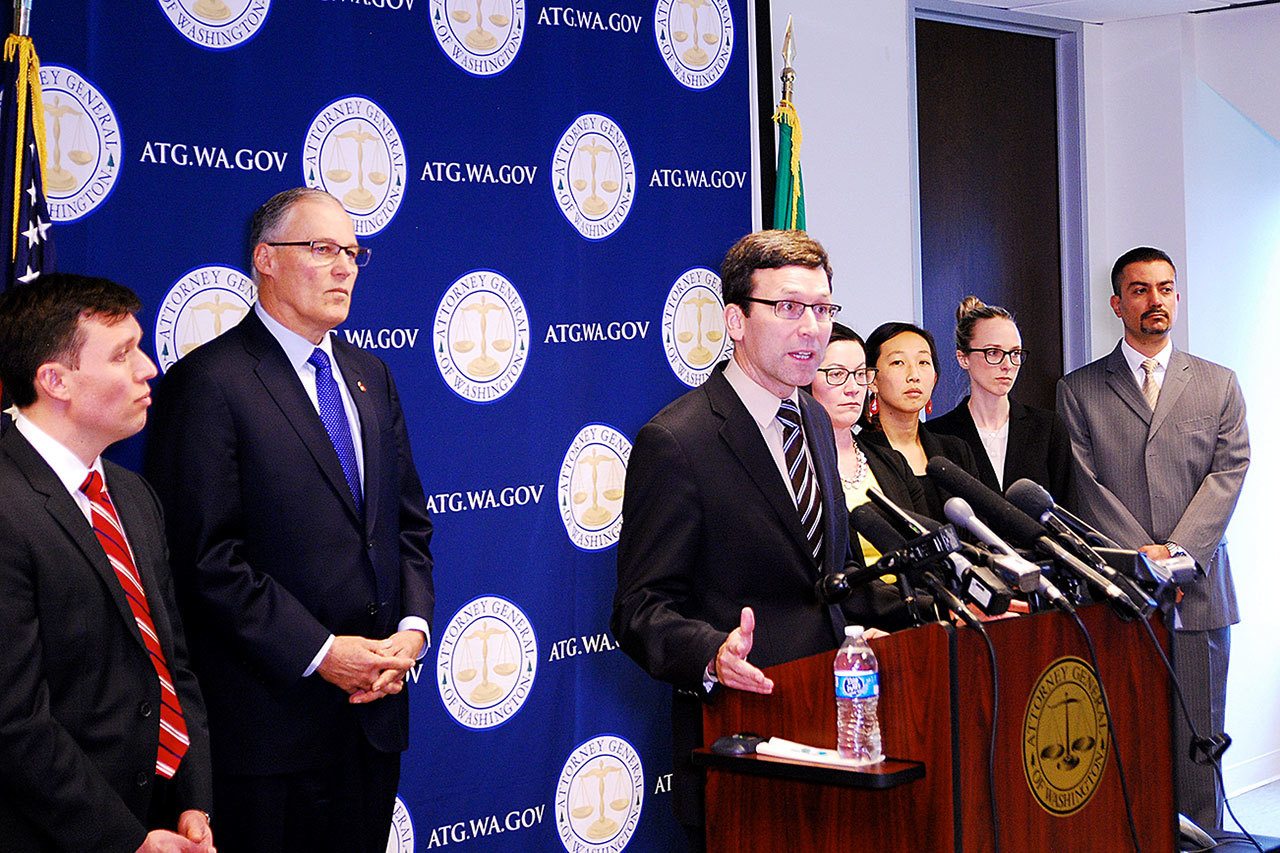 State Attorney General Bob Ferguson announced Monday his office will file a federal lawsuit against President Donald Trump, the U.S. Department of Homeland Security and high-ranking Trump Administration officials. In the suit, Ferguson asks the United States District Court for the Western District of Washington to declare unconstitutional key provisions of President Donald Trump’s immigration Executive Order. Pictured left to right are Solicitor General Noah Purcell, Governor Jay Inslee, Ferguson, Wing Luke Civil Rights Unit Chief Colleen Melody, Assistant Attorney General Marsha Chien, Solicitor General’s Office Fellow Kelly Paradis, and Assistant Attorney General Patricio Marquez. (Photo courtesy Attorney General’s Office)