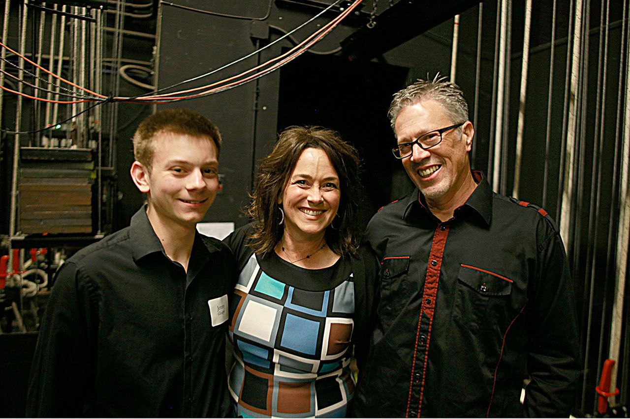 Play it Forward co-founders Kristi Daniels (center) and Wil Russoul (right) pose with Jeremy Glasgow, the recipient of the first-ever Play it Forward $1,000 scholarship given May 25, 2016, at Grays Harbor College’s Bishop Center.                                 Play it Forward co-founders Kristi Daniels (center) and Wil Russoul (right) pose with Jeremy Glasgow, the recipient of the first-ever Play it Forward $1,000 scholarship given May 25, 2016, at Grays Harbor College’s Bishop Center.