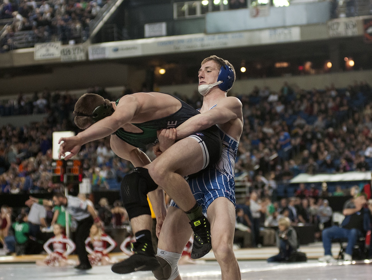 (Brendan Carl | The Daily World) Elma’s Justin Sample works to throw Dalton Young of Lakeside Nine Mile Falls on Saturday.