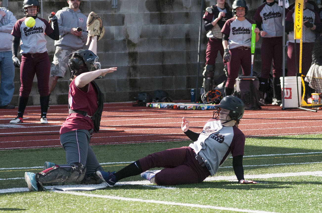 (Brendan Carl | The Daily World) Montesano’s Lexi Lovell slides home to score the Bulldogs second run of the game against Hoquiam on Thursday. The Bulldogs defeated the Grizzlies 6-5.