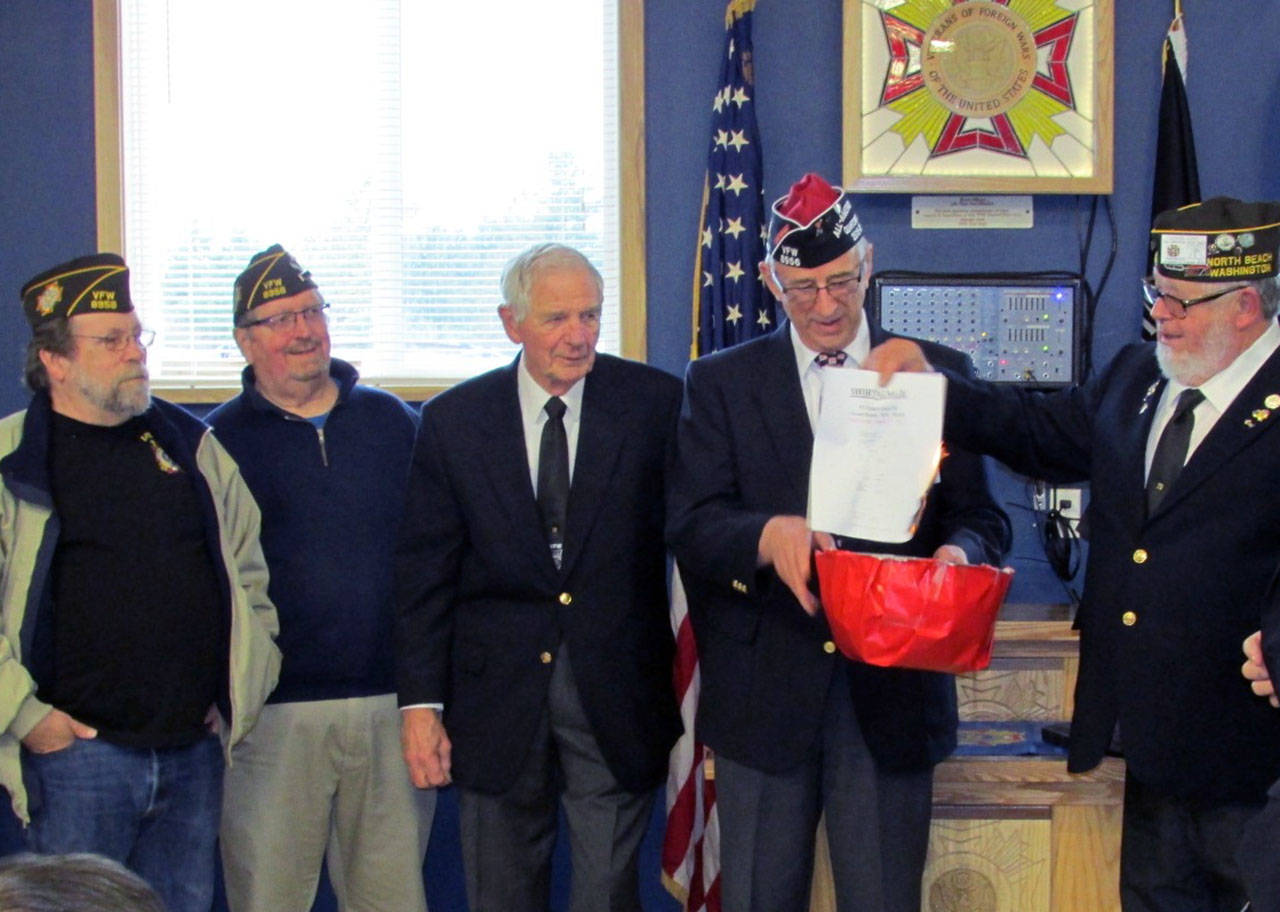 Photo by Scott D. Johnston: On hand for the mortgage burning were newly installed Post officers (L-R) Otis Warren, Robert Hakanson, Bob Howe, Jim Docherty, John Link, Dan Martin and Robin Johnson.