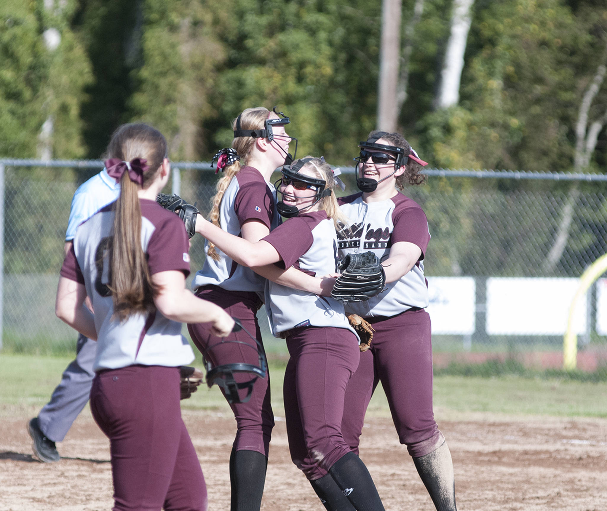 (Brendan Carl | The Daily World) Montesano’s Samantha Stanfield, left, Morgan Kersker, center, and Allyssa Gustafson celebrate after the Bulldogs defeated Elma 3-1 on Wednesday.
