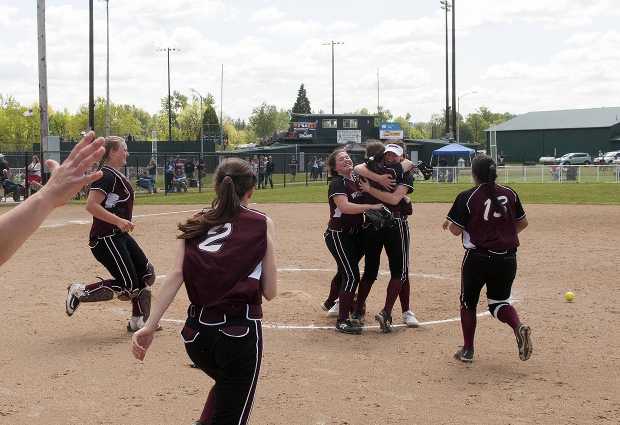 (Brendan Carl | The Daily World) Ocosta players celebrate defeating Adna 6-2 to earn the school’s first ever state tournament berth on Saturday.