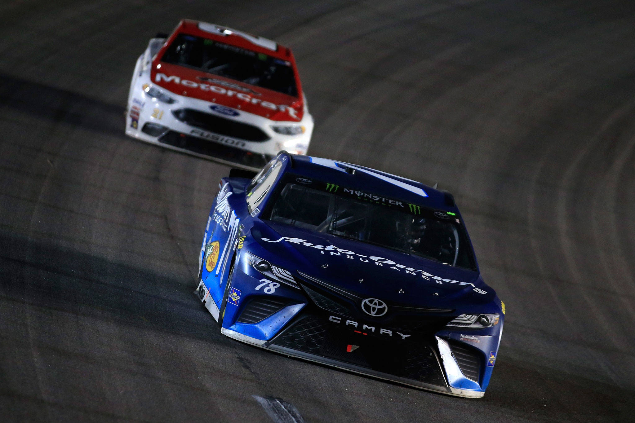 (Chris Trotman | NASCAR) Martin Truex Jr. leads Ryan Blaney during the Monster Energy NASCAR Cup Series Go Bowling 400 at Kansas Speedway on Saturday in Kansas City, Kansas. Truax Jr. won the race.