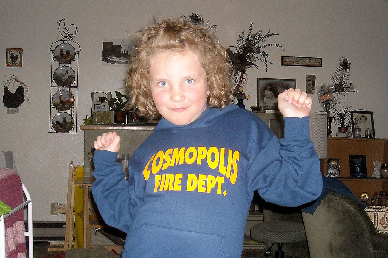 A 2011 picture of then 8-year-old Susie Marie. That year marked her fifth at the lemonade stand, and she collected $1,863 for the Cosmopolis Fire Department; last year, she raked in nearly $3,500.