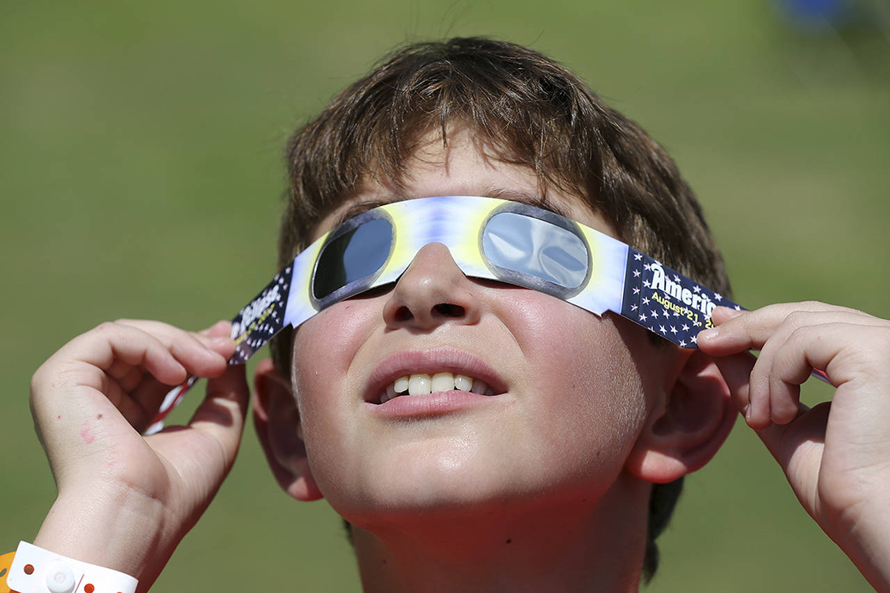 As long as the solar filters on your glasses are not scratched, punctured or torn, there is no reason you can’t use them again. (Curtis Compton | Atlanta Journal-Constitution)