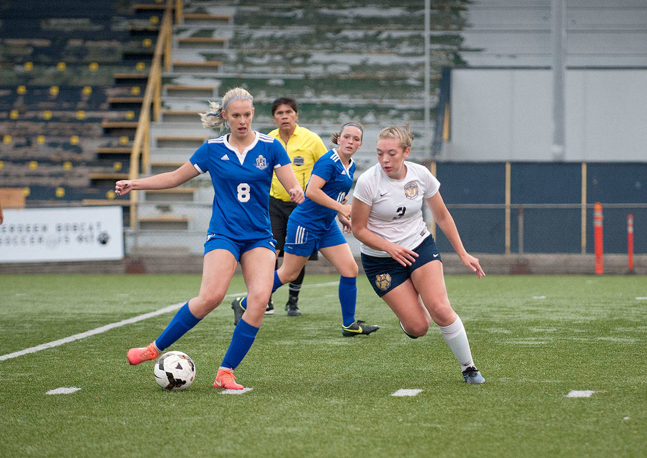 Elma’s Brooke Sutherby, left, is defended by Aberdeen’s Taylor Coker during Tuesday’s match at Stewart Field that ended in a scoreless tie. (Photo by Corie Bradt)