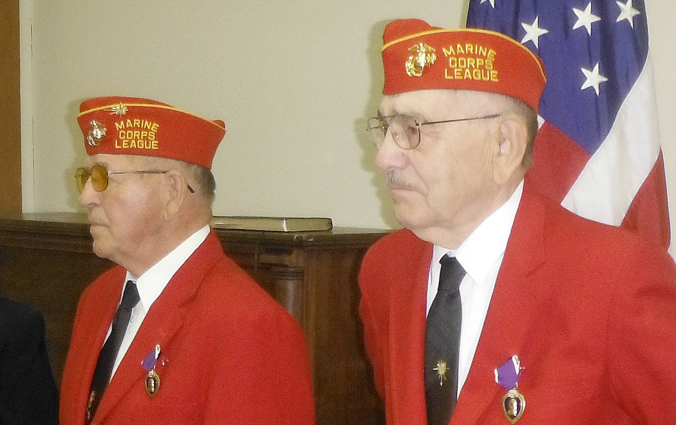 DAN HAMMOCK | THE DAILY WORLD                                Irv Stephens, left, and Jim Evans pose with the Purple Hearts they earned more than 65 years ago in the Korean War. The two Grays Harbor residents were surprised with the medals at a Department of Veterans Affairs meeting in Aberdeen.