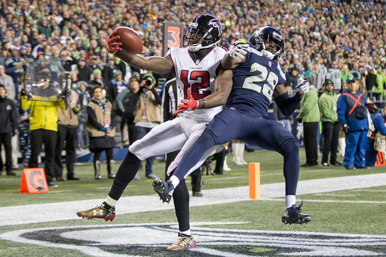 Atlanta Falcons wide receiver Mohamed Sanu (12) catches a 2-yard touchdown pass against Seattle Seahawks cornerback Justin Coleman in the first quarter at CenturyLink Field in Seattle on Monday, Nov. 20, 2017. (Bettina Hansen/Seattle Times/TNS)