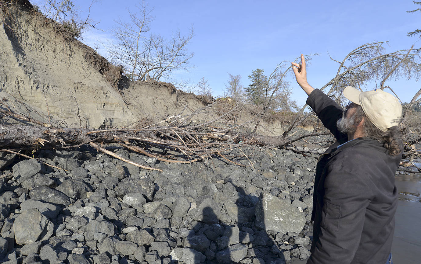 DAN HAMMOCK | THE DAILY WORLD Pacific County Drainage District commission chairman David Cottrell shows a section of bank benefiting from dynamic revetment, the placing of cobble on beaches designed to diffuse the impact of waves and protect the shoreline. This bank is off the end of old State Route 105.