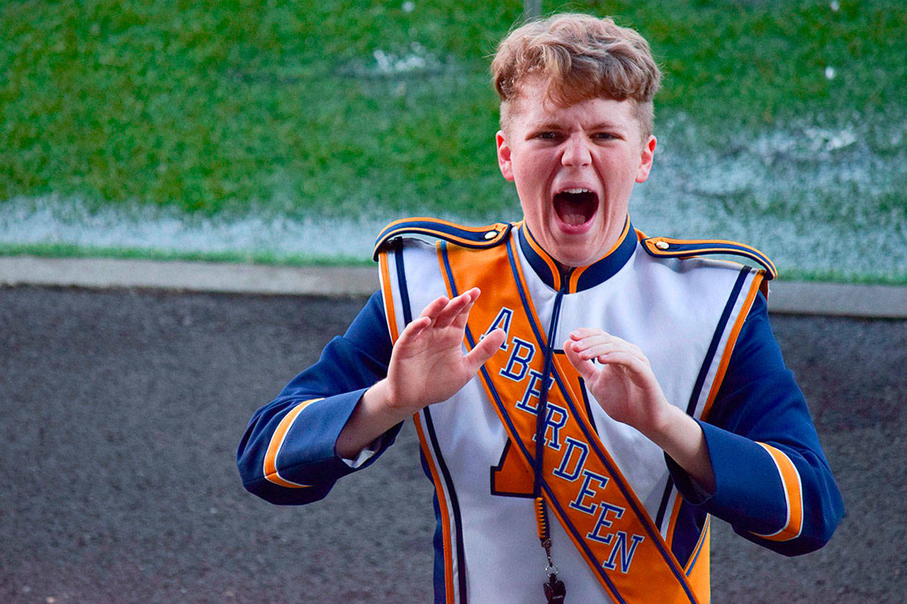 (Courtesy Karin Beard) Eric Beard conducts the Aberdeen High School marching band. Beard is one of 60 All-American drum majors invited to perform in the London New Year’s Day Parade.