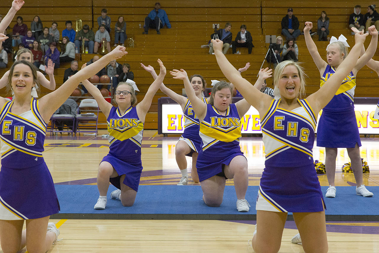 Mark Hoffman | Milwaukee Journal Sentinel                                 Sparkle cheerleaders Matilda Gillard (center left) and Victoria Loyo (center right) are framed by varsity cheerleaders Hailey Fortier (left) and Jodie Gurda (right) on Dec. 12 at New Berlin Eisenhower High School in New Berlin, Wisconsin.