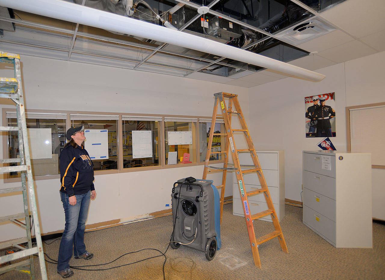 LOUIS KRAUSS | THE DAILY WORLD Principal Sherri Northington stands in the second-floor Guidance Center of Aberdeen High School, where a broken pipe dumped heating system fluid and forced the school to close Wednesday. This photo was taken after the many fallen ceiling panels were cleaned up.