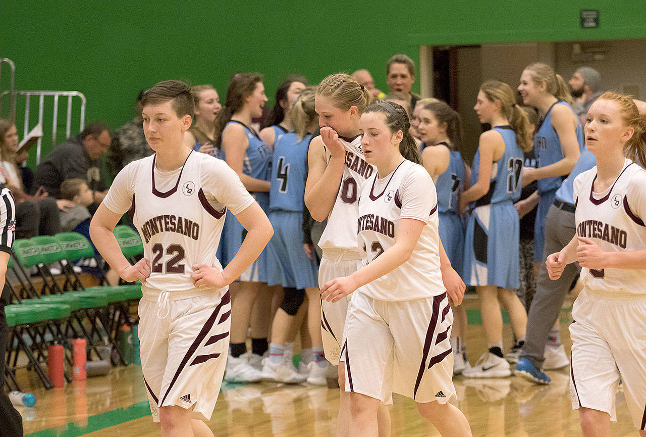 Montesano players make an emotional walk off the court as Freeman celebrates on Saturday. (Brendan Carl Photography)