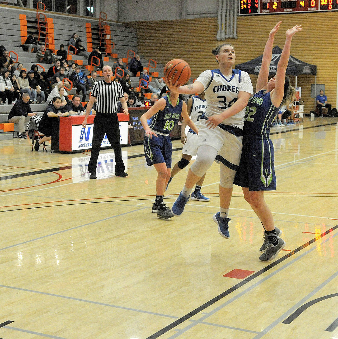 Grays Harbor College’s Sandin Kidder hits a scoop layup in the first half against Big Bend on Thursday. (Hasani Grayson | The Daily World)