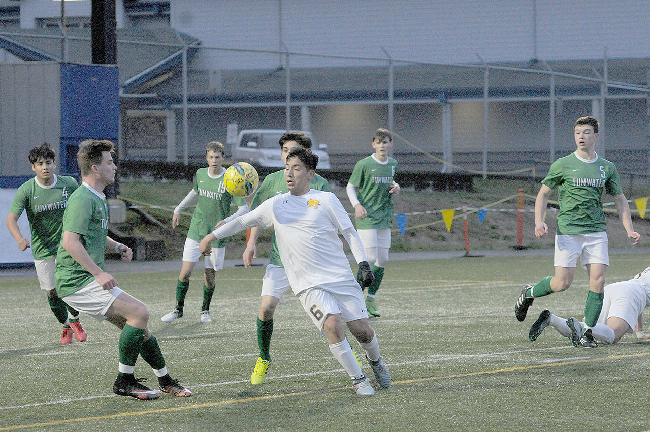 Aberdeen’s Rigo Alavez tries to control the ball with his chest while Tumwater defenders close in. Tumwater beat Aberdeen, 2-0, on Tuesday at Stewart Field. (Hasani Grayson | The Daily World)