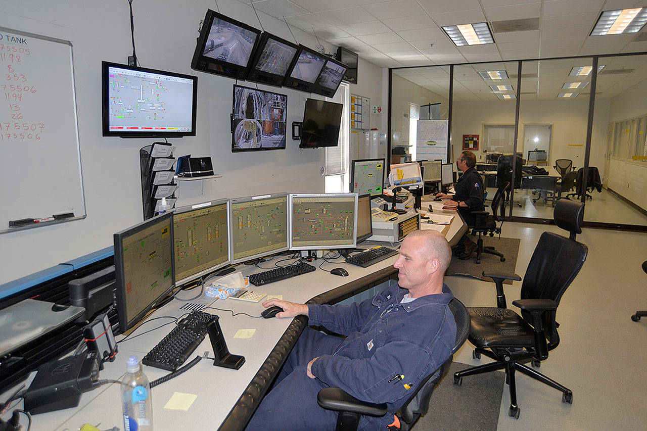 LOUIS KRAUSS | THE DAILY WORLD Operations Technician Mike Wallin monitors the production of sodium borohydride in the control room for Ascensus Specialties in Elma.