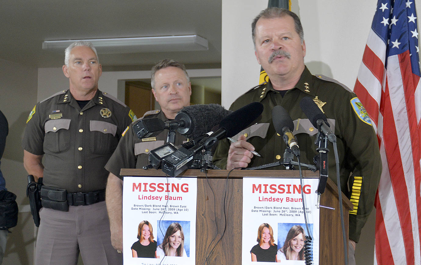 DAN HAMMOCK | THE DAILY WORLD                                Grays Harbor County Sheriff Rick Scott (right) announces the positive identification of the remains of Lindsey Baum, who was 10 years old when she vanished from McCleary in 2009. Her remains were discovered in a remote area of Eastern Washington in 2017 and identified a few weeks ago.