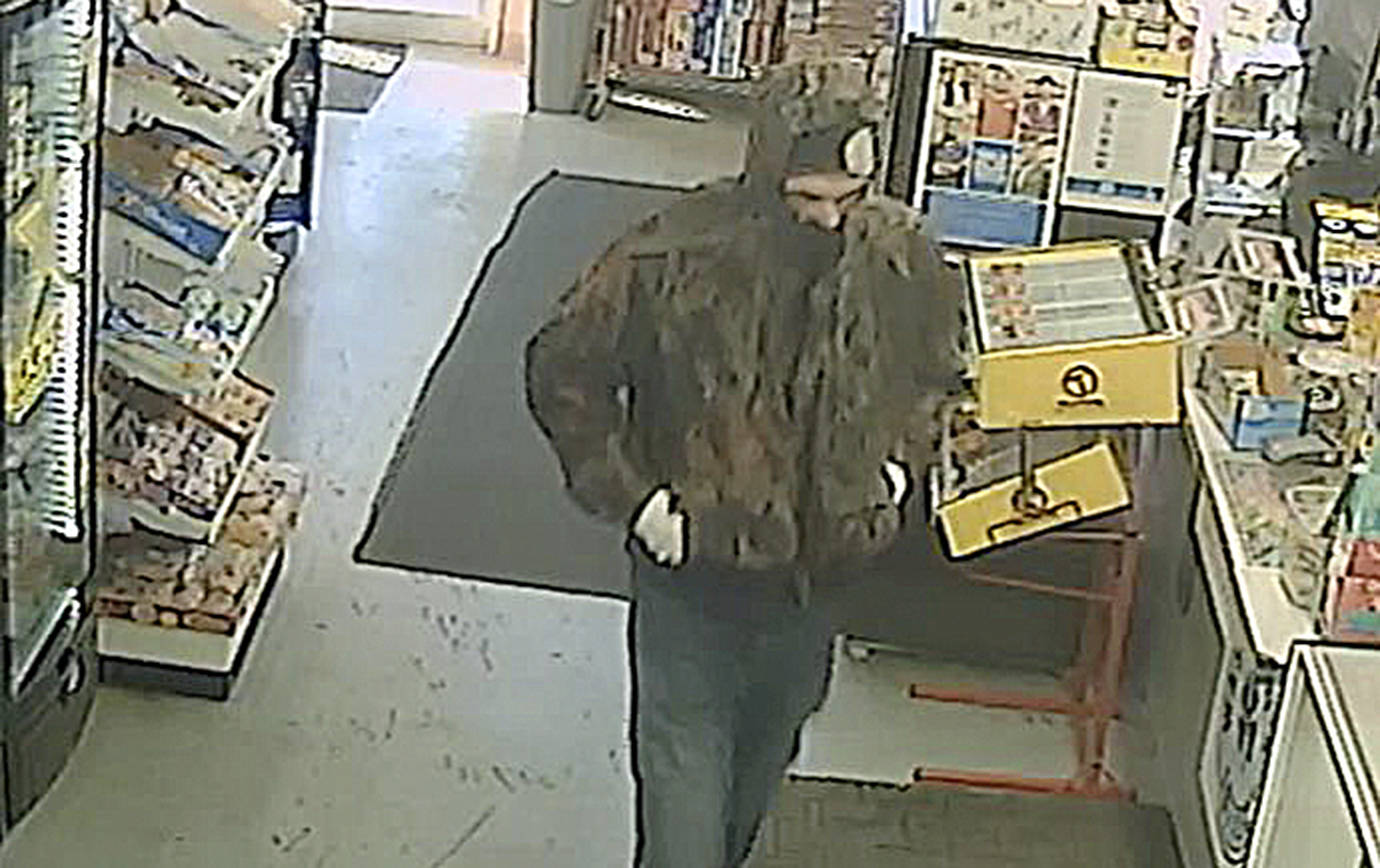 HOQUIAM POLICE DEPARTMENT                                Hoquiam Police are seeking this man, who was caught on video robbing the SmokeTown convenience store on Simpson Avenue Friday evening. Armed with a large black knife, the man was able to evade capture even after being confronted by an armed citizen as he attempted to pry open the store’s cash drawer with the knife.