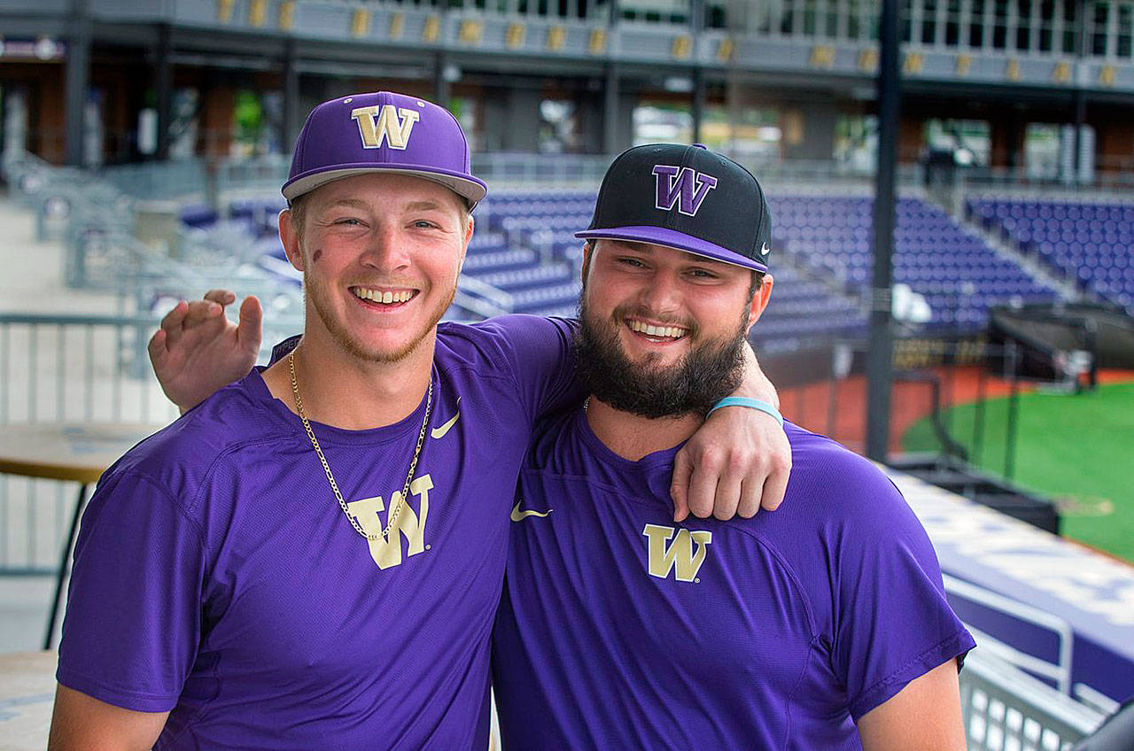 UW catcher Willie MacIver, left, his dear friend, pitcher Joe DeMers are pictured at Husky Ballpark before departing for the College World Series. (Ellen M. Banner/The Seattle Times)