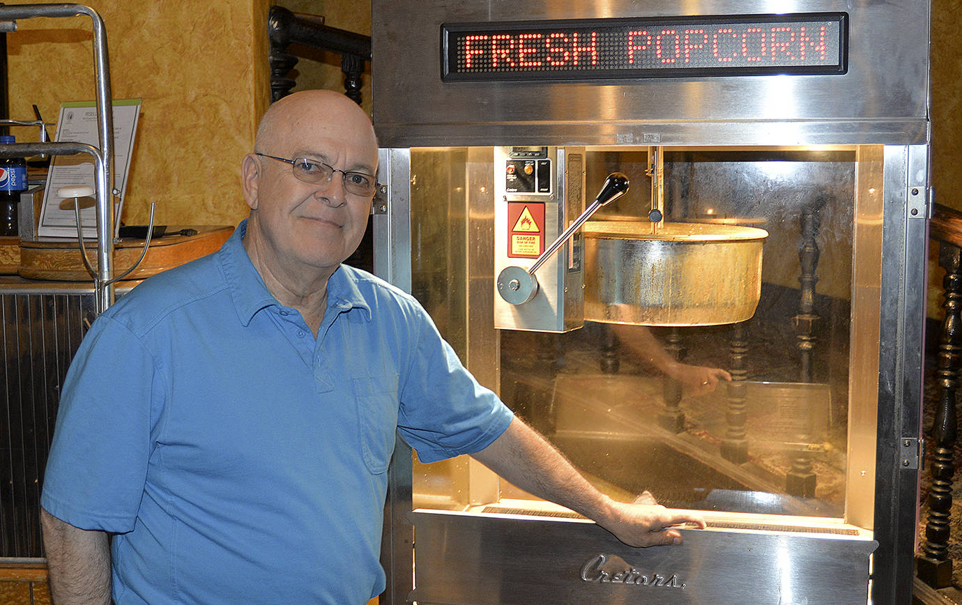 DAN HAMMOCK | THE DAILY WORLD                                County Coroner Lane Youmans plans to spend even more time dishing out popcorn at the 7th Street Theatre after he retires later this year. Between the Coroner’s Office and Sheriff’s Office, Youmans has been serving the public for more than 40 years.