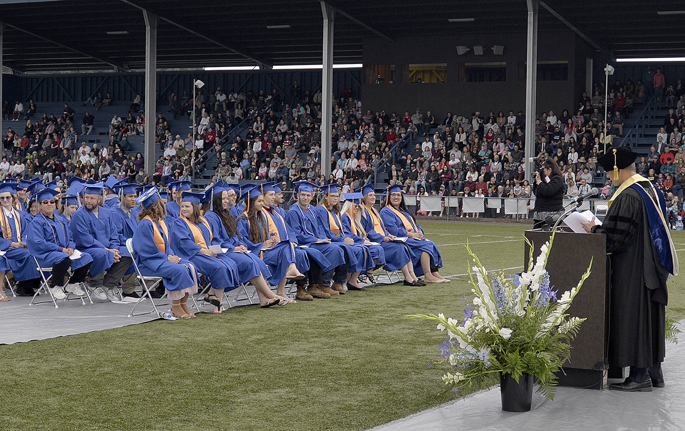 DAN HAMMOCK | THE DAILY WORLD                                Grays Harbor College president Dr. Jim Minkler addresses graduating students at Friday night’s commencement ceremony at Stewart Field in Aberdeen.