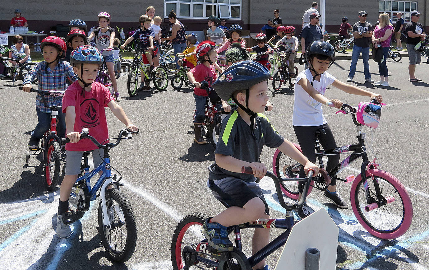 COURTESY PHOTO                                Kids line up at the Bill Brookshire Memorial Bicycle Rodeo in the Montesano High School parking lot June 23.