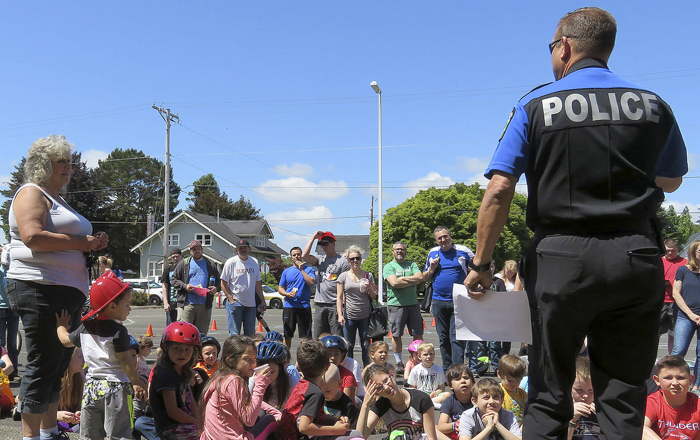 COURTESY PHOTO                                Montesano Police Chief Brett Vance announces the winners of a bike drawing at the Bill Brookshire Memorial Bicycle Rodeo held June 23.