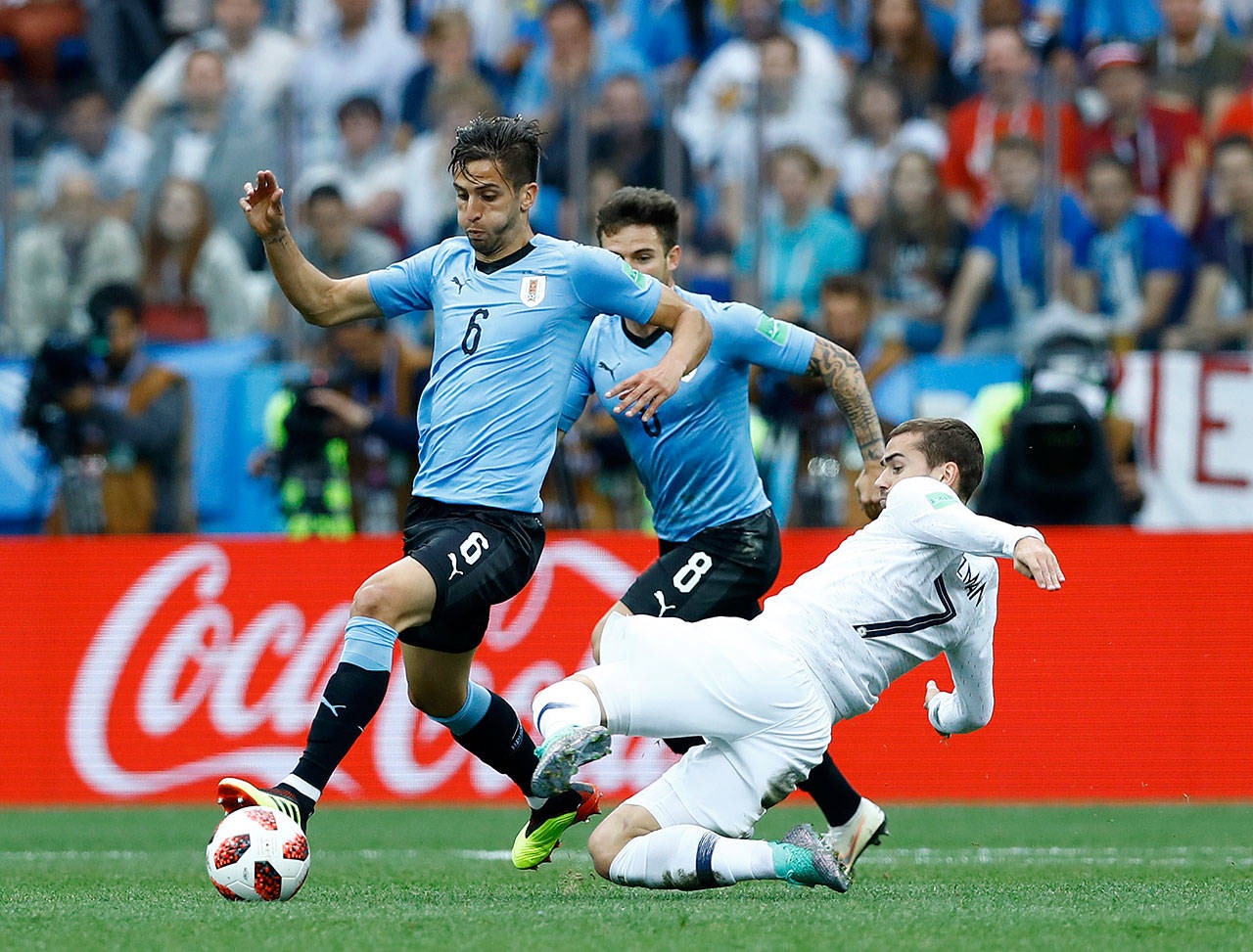 France’s Antoine Griezmann (7) attempts a tackle on Uruguay’s Rodrigo Betancur (7) at Nizhny Novgorod Stadium in Russia on July 6, 2018. France won the match 2-0 and will face Belgium in a World Cup Semifinal on Tuesday. (Photo by Matteo Ciambelli/NurPhoto/Sipa USA)