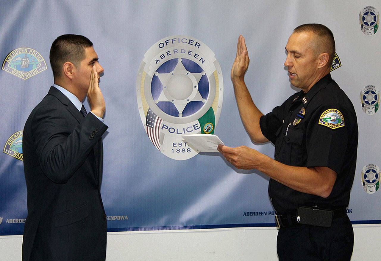 (Courtesy photo) Aberdeen Police Chief Steve Shumate swears in Jesus Martinez-Lopez.