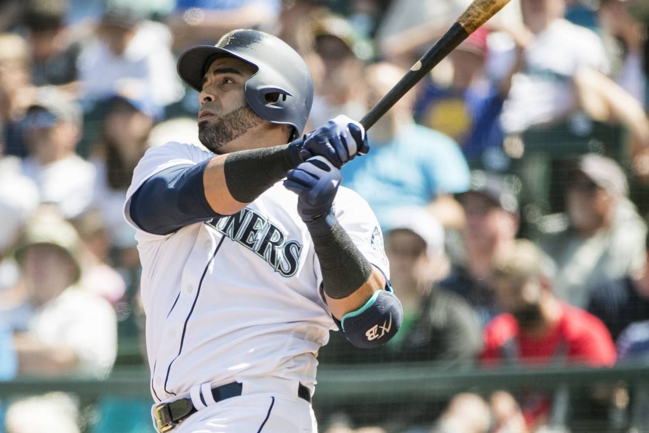 The Seattle Mariners’ Nelson Cruz smacks a solo home run in the sixth inning against the Houston Astros on Wednesday, Aug. 1, 2018, at Safeco Field in Seattle. The Astros won, 8-3. (Bettina Hansen/Seattle Times/TNS)