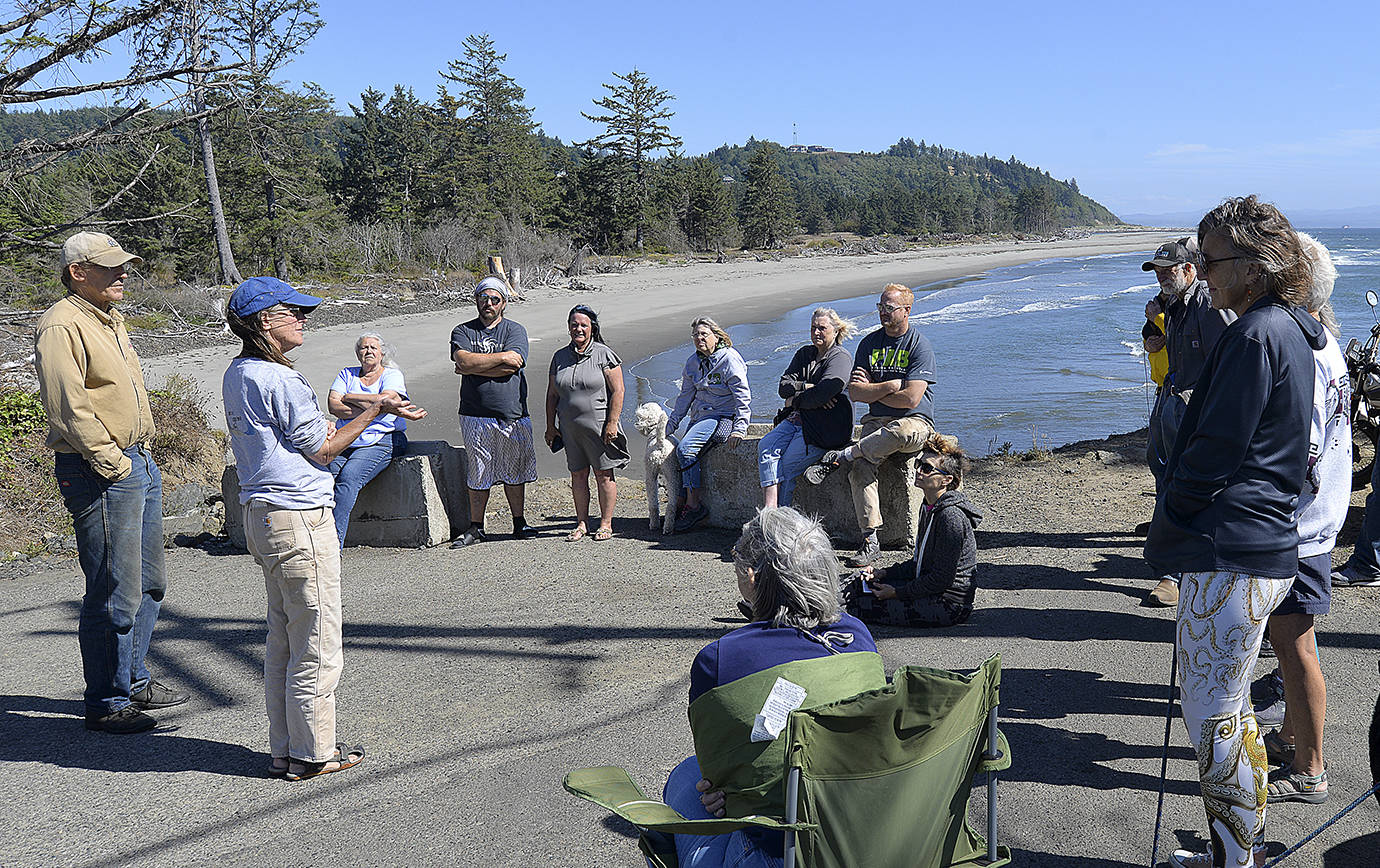 DAN HAMMOCK | THE DAILY WORLD                                Connie Allen, Washaway No More chairwoman (second from left) updates locals about the continued efforts to prevent shoreline erosion in the North Cove area at the end of old State Route 105 Monday afternoon. At left is David Cottrell, irrigation district board chairman.