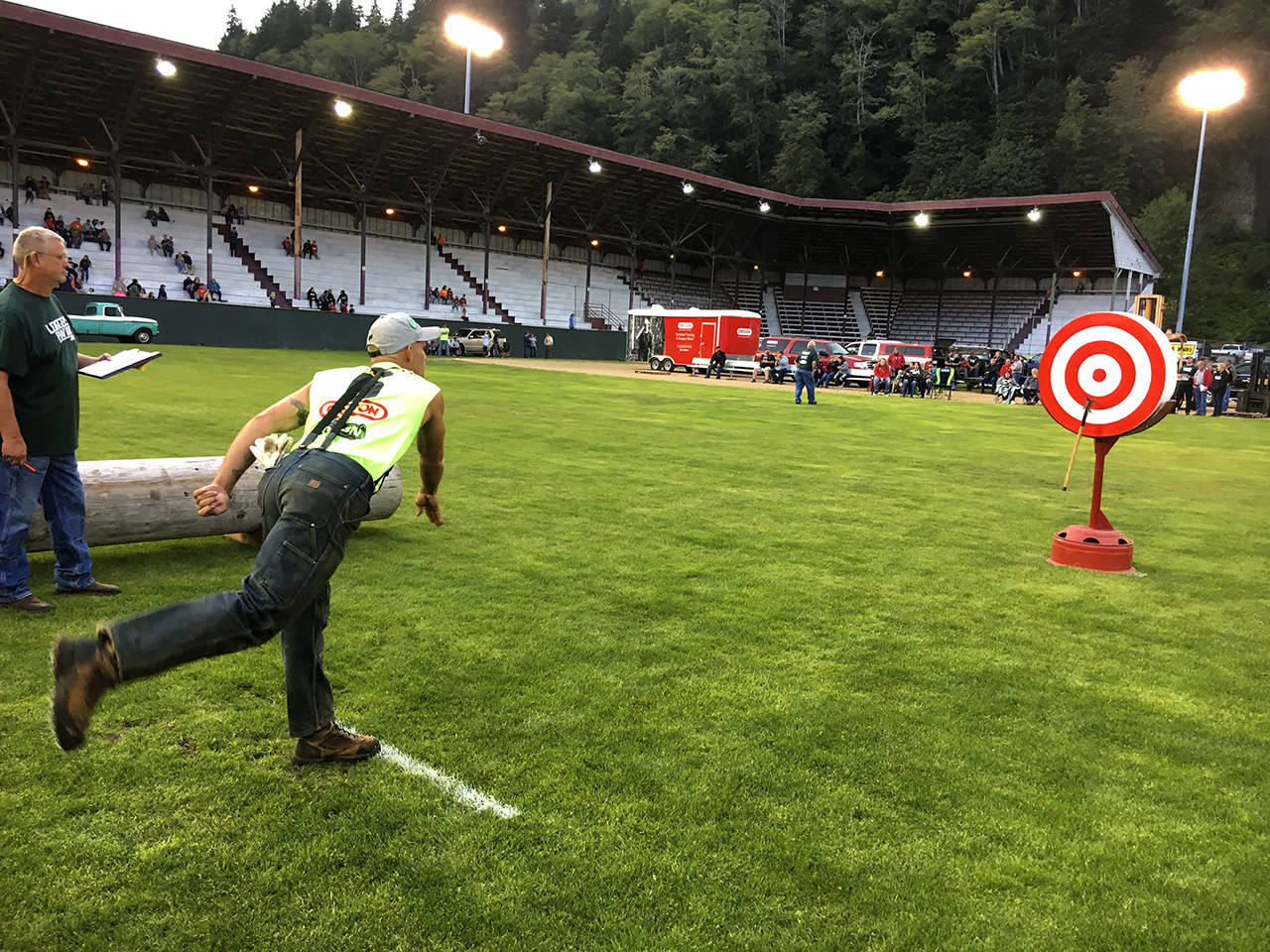 (Kat Bryant | The Daily World) Local logger Johnny Boggs took third in the Ax Throw and ended the night as High Point Logger.