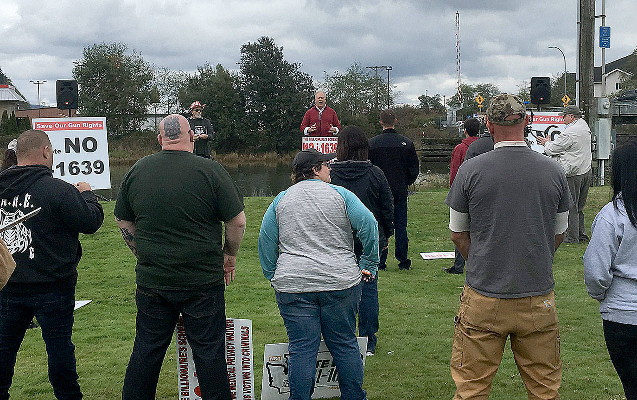 Rep. Jim Walsh (R-Aberdeen) addresses the audience of 50 or more at the No on Initiative 1639 rally held at Zelasko Park Saturday. He said the initiative is bad policy and would only strip legal gun owners of their right to defend themselves. (DAN HAMMOCK | GRAYS HARBORS NEWSPAPER GROUP)