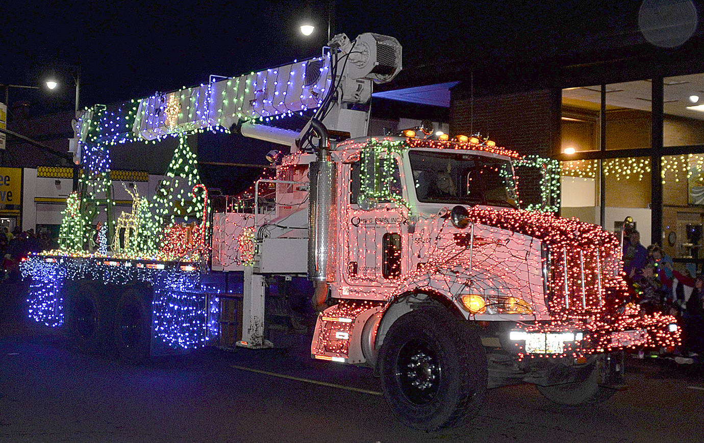 DAN HAMMOCK | GRAYS HARBOR NEWS GROUP The Quigg Brothers Construction entry in the Montesano Festival of Lights Saturday evening earned the parades sweepstakes award.