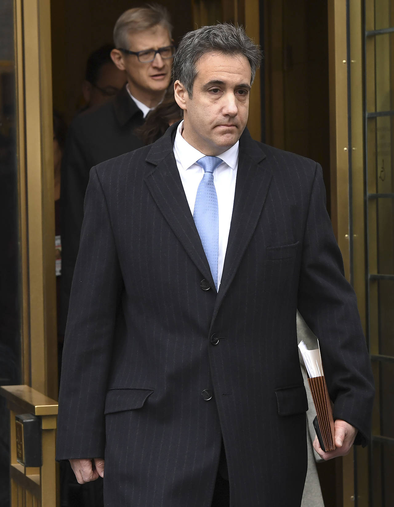 President Donald Trump’s former attorney Michael Cohen leaves U.S. Federal Court in New York on Wednesday after his sentencing. Cohen, 52, said he was taking responsibility for his crimes, “including those implicating the president of the United States of America.” (Timothy A. Clary | AFP)