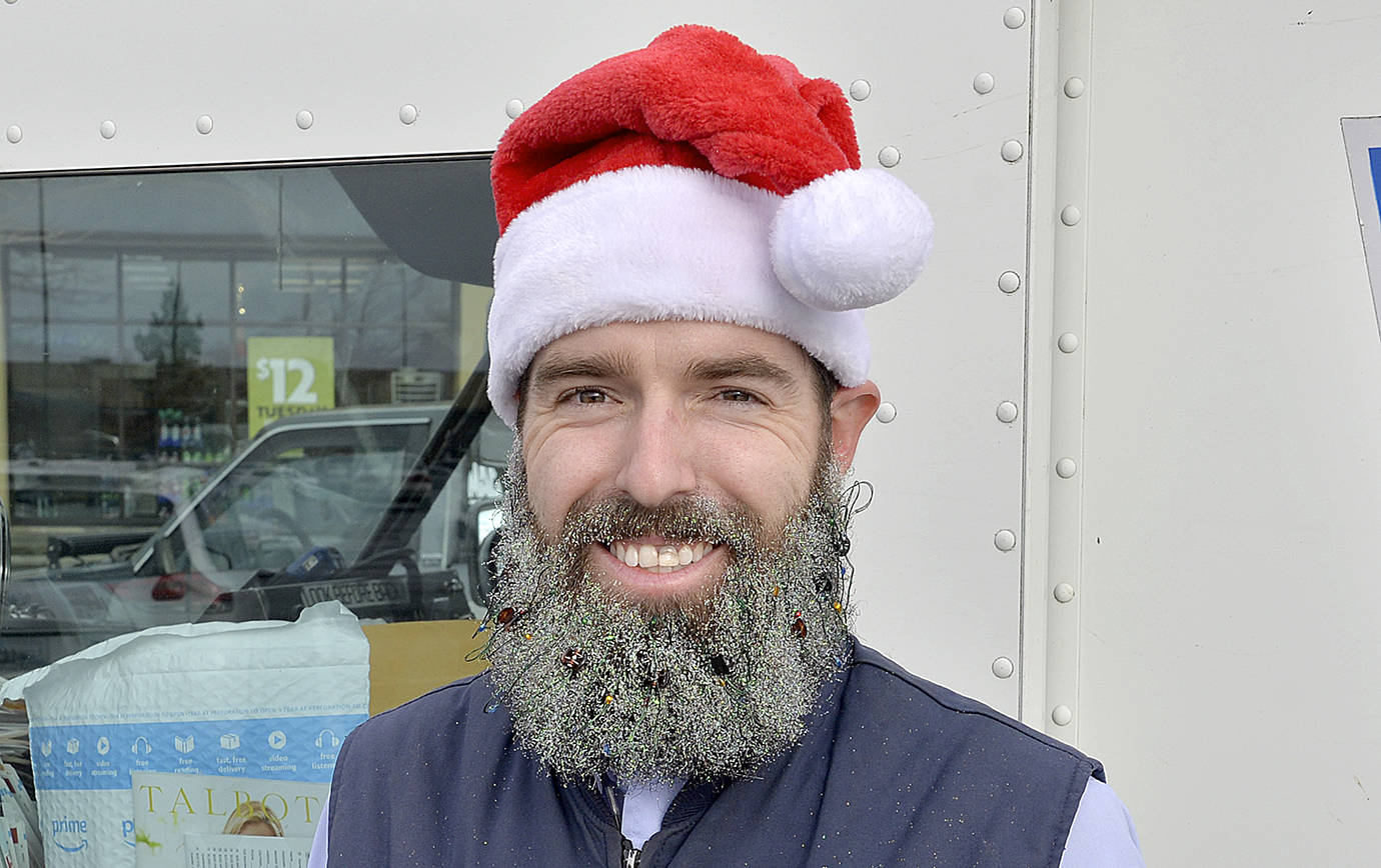 DAN HAMMOCK | GRAYS HARBOR NEWS GROUP                                Caleb Small is a young family man from Cosmopolis who wondered, how could he, as a postal carrier in Aberdeen, brighten everyone’s day? His solution was to grow out his beard and festoon it with twinkling lights and glitter. The father of five said he just wanted to find a way to spread joy on a daily basis.