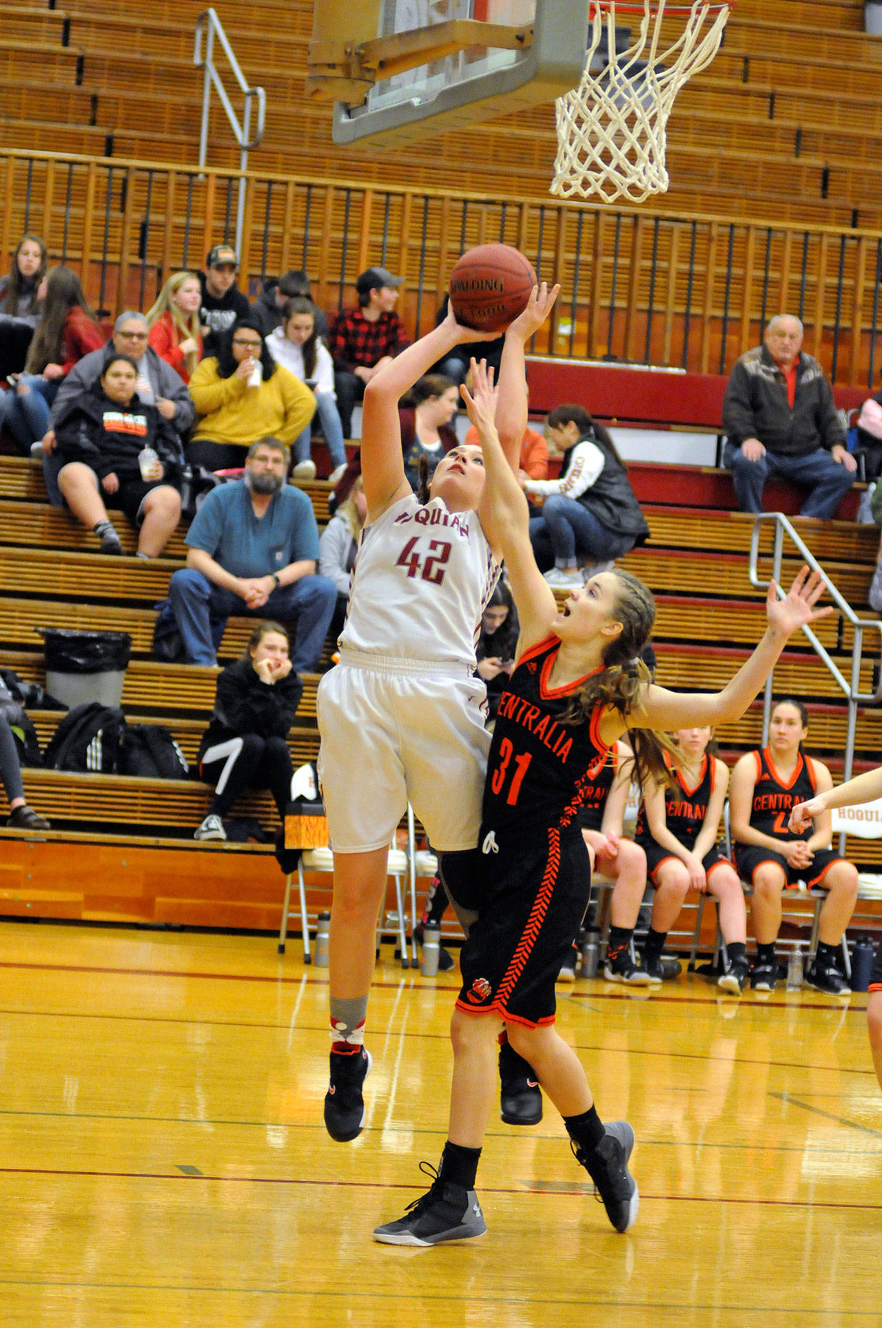 Hoquiam’s Rylee Vonhoff (42) scores over Centralia’s Madelinn Corwin during the Grizzlies’ 53-42 win over Centralia on Wednesday at Hoquiam Square Garden. (Ryan Sparks | Grays Harbor News Group)