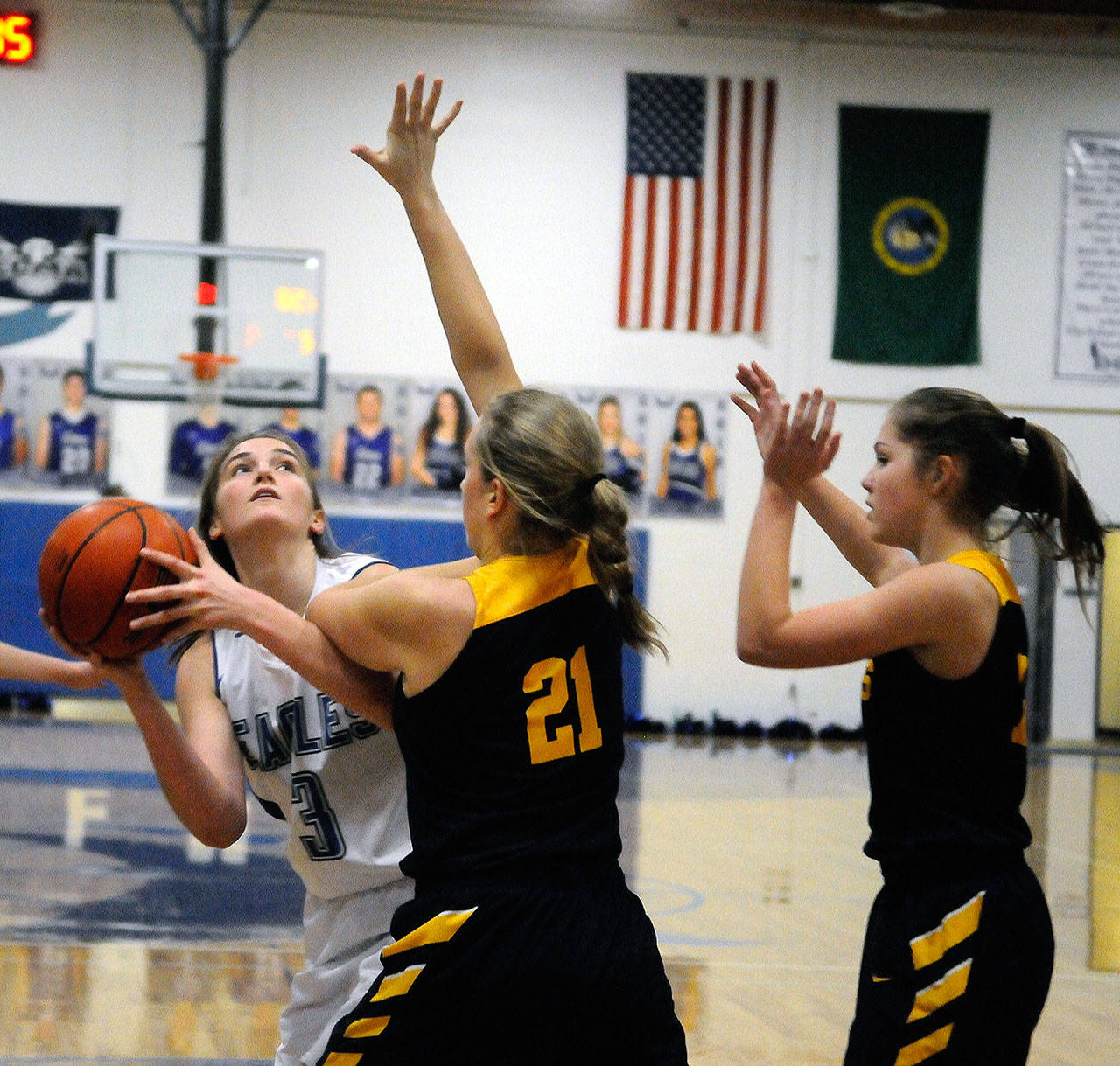 Elma’s Jalyn Sackrider (3) battles for position in the low post while defended by Forks’ Chloe Leverington in the first quarter on Thursday. Sackrider led the Eagles with 14 points in Elma’s 75-37 win.(Hasani Grayson | Grays Harbor News Group)