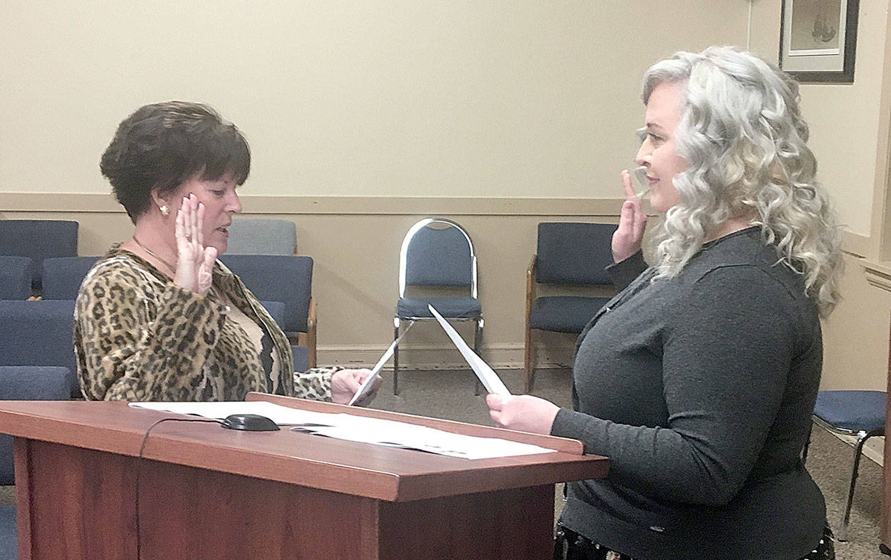 DAN HAMMOCK | GRAYS HARBOR NEWS GROUP                                Mary Stinchfield, left, is sworn in to the Hoquiam City Council Ward 6 position by Hoquiam Mayor Jasmine Dickhoff Monday. She replaces Angela Forkum who resigned in December to focus on family matters.