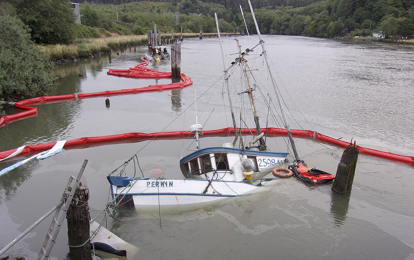 COURTESY DEPARTMENT OF ECOLOGY SPILLS PROGRAM                                The fishing vessel Perwyn sank in the Hoquiam River in late July. Department of Ecology crews removed 130 gallons of diesel fuel from the 47-foot vessel, but the vessel did spill 50 gallons into the river before it was contained.