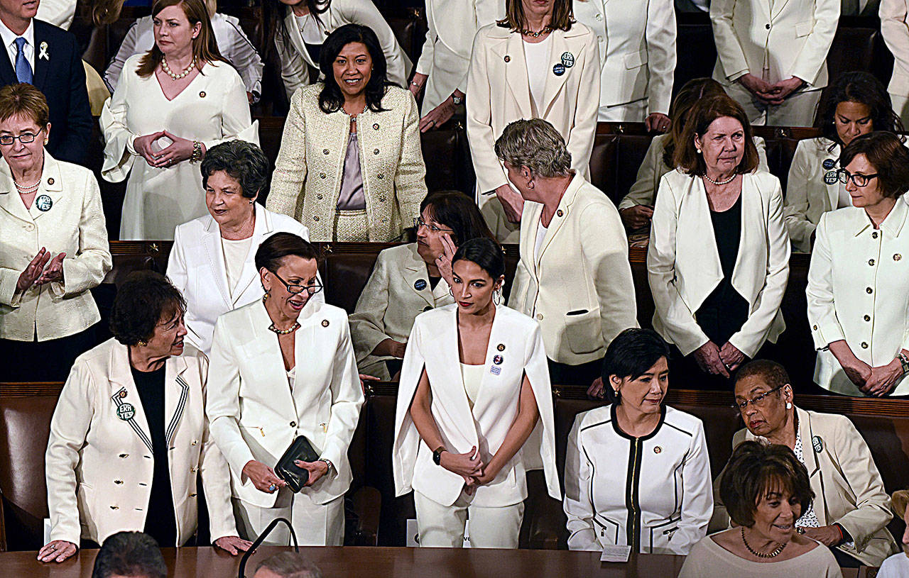 House Democratic women, dressed in white to celebrate the 100th anniversary of Congress voting to grant women the right to vote, prior to President Trump’s State of the Union address to a joint session of Congress on Capitol Hill in Washington, D.C., on Tuesday. (Olivier Douliery/Abaca Press/TNS)