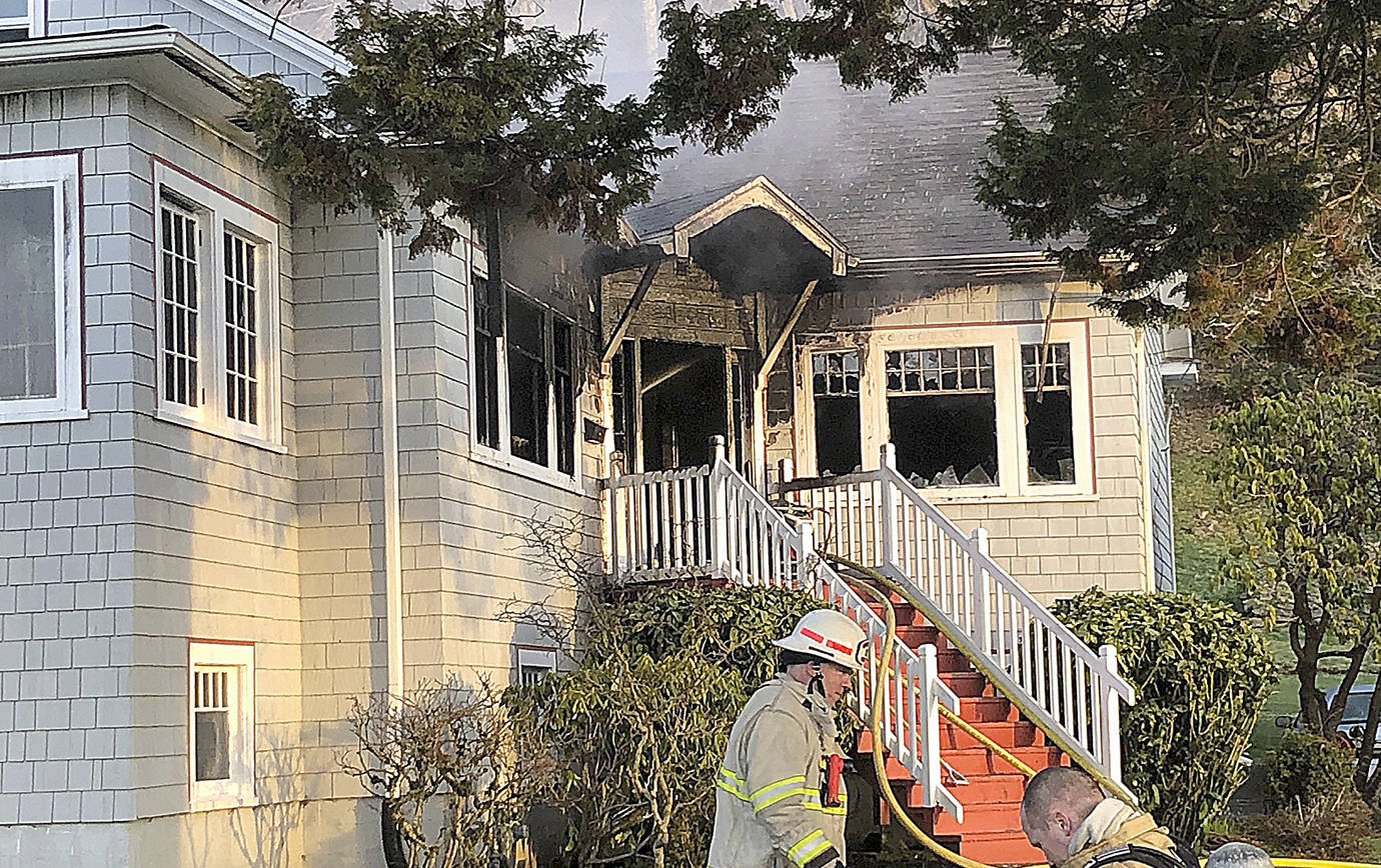 COURTESY HOQUIAM POLICE DEPARTMENT                                Firefighters from Hoquiam and Aberdeen battled a blaze at a home at corner of 23rd Street and Queets Avenue Thursday morning. The main floor was heavily damaged by fire and smoke but two residents in the home were able to get out safely.