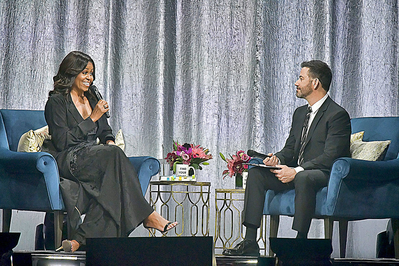 Michelle Obama drew more than 18,000 people to the Tacoma Dome on Sunday, the largest turnout so far on her international book tour. Jimmy Kimmel, right, was host and interviewer for the event. (&lt;em&gt;&lt;strong&gt;Photo by Darrell Westmoreland&lt;/strong&gt;&lt;/em&gt;)