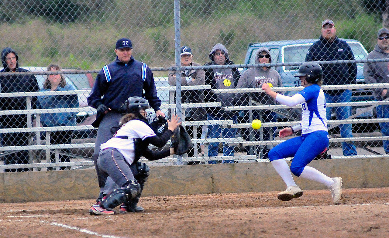 Elma’s Kali Rambo slides home and avoids the tag from Hoquiam’s Emiley Elders in the seventh inning on Tuesday. (Hasani Grayson | Grays Harbor News Group)