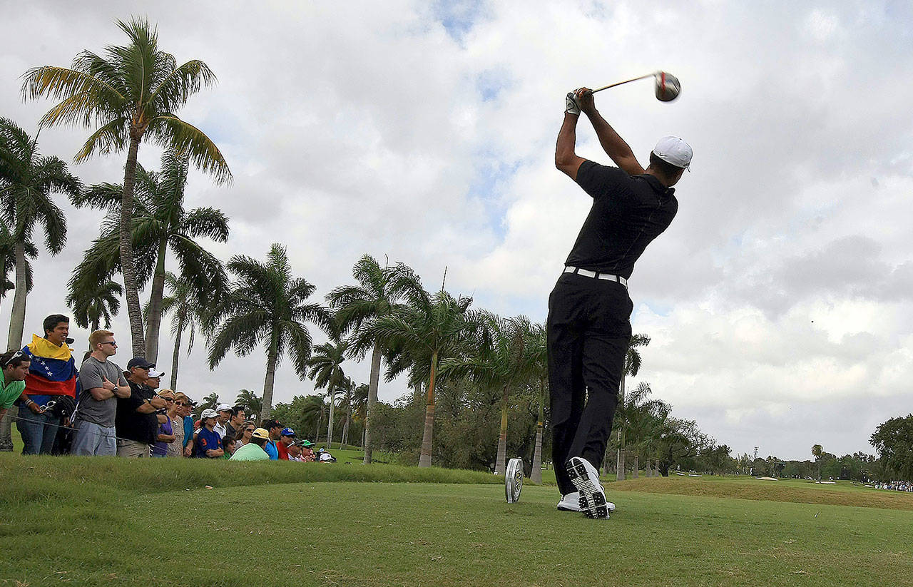 Tiger Woods tees off on the second hole of the Doral Golf Resort in Doral, Florida, in 2012. Donald Trump bought the former Marriott Doral out of bankruptcy in 2012, but his presidential campaign cost the resort its star attraction: the annual Cadillac golf tournament, which drew Tiger Woods and other stars to the resort’s famed Blue Monster course each spring. (Mike Stocker/Sun Sentinel/)