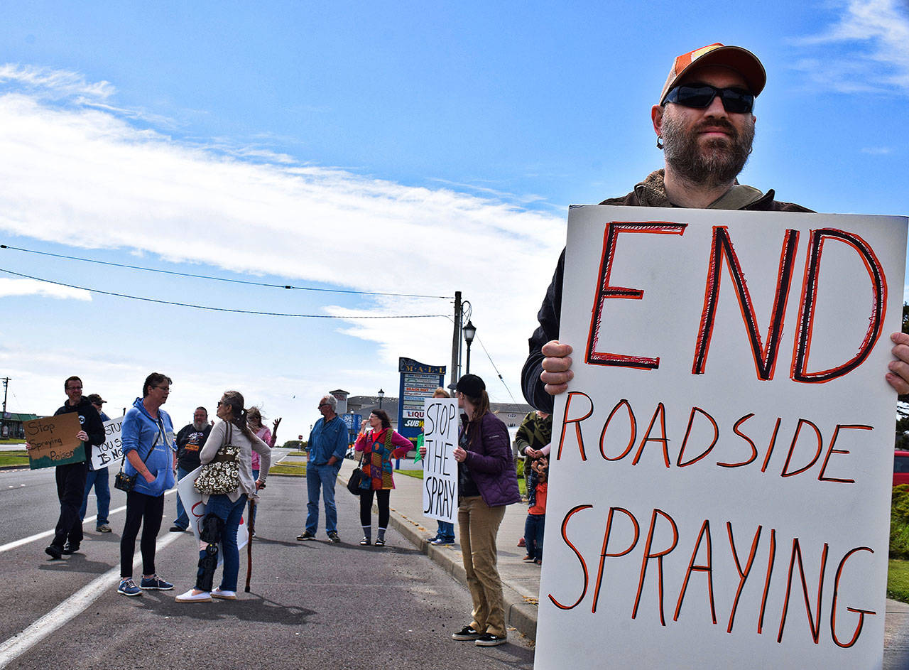 Scott D. Johnston | Grays Harbor News Group                                Ocean Shores resident Matt Cyphert was among about 15 who gathered on Chance a la Mer Boulevard in front of the Convention Center last week to protest the roadside weed spraying in the city.