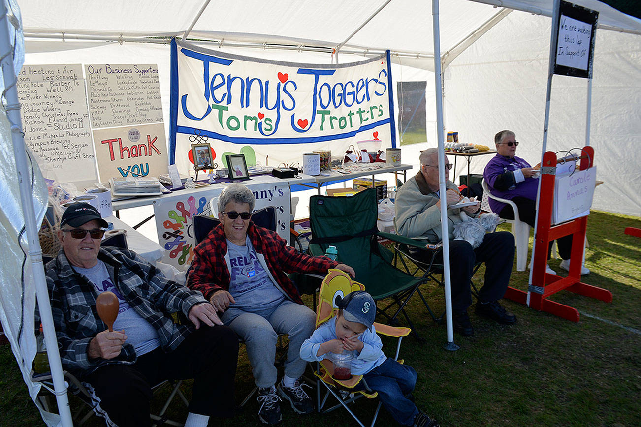 (Louis Krauss | Grays Harbor News Group) Members of the team Jennys Joggers/Toms Trotters sit inside their tent at Relay For Life Grays Harbor on Friday afternoon in Hoquiam.