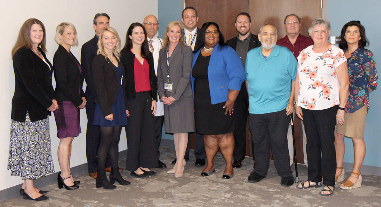 Members of the Hospital District No. 1 Board of Commissioners and Summit Pacific Medical Center leadership pose with representatives of the federal Department of Health and Human Services’ Health Resources and Services Administration on July 18 in Elma after the announcement that the hospital district would receive a nearly $750,000 grant to help start its family medicine residency program. (Michael Lang | Grays Harbor News Group)