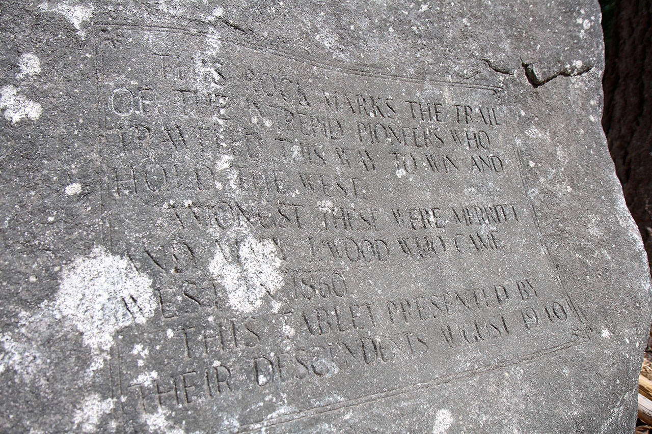 Portions of the inscription craved into the face of Pioneer Rock can be read Wednesday, July 24, 2019, at the Boy Scouts of America’s Camp Thunderbird at Summit Lake in Thurston County. Two area men hope to move the 29-ton granite rock to the rest area east of Elma. (Michael Lang | Grays Harbor News Group)